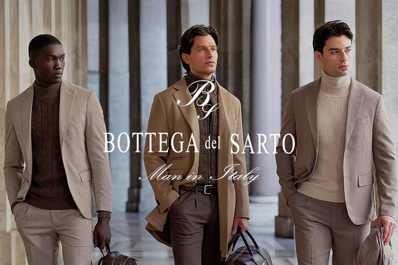 Tre uomini vestiti in giacca e cravatta tengono una borsa nella mano sinistra. Tutti e tre guardano verso sinistra.